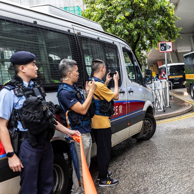 A vehicle carrying Hong Kong media mogul Jimmy Lai arrives outside the West Kowloon court where Lai's national security trial is being held in Hong Kong on Monday.