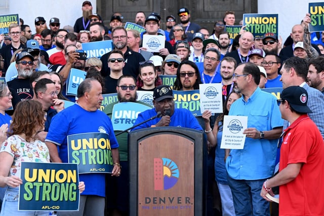 Ronnie Houston, a 50-year teamster, center, addresses the crowd during a rally on the steps of the City and County Building in Denver on July 8, 2024. Dozens of workers and supporters of the Stronger Denver Campaign rallied to support a Denver City Council measure to let voters decide to extend collective bargaining rights to all non-supervisory city and county of Denver employees. The rally was held in advance of a final Denver City Council vote on the ballot measure. Currently, the Denver Charter only grants collective bargaining rights to Denver Fire, Police, and deputy sheriffs. This measure would allow voters this fall to extend the basic labor rights and protections to solid waste collectors. social workers, librarians and workers in non-supervisory roles. (Photo by Helen H. Richardson/The Denver Post)