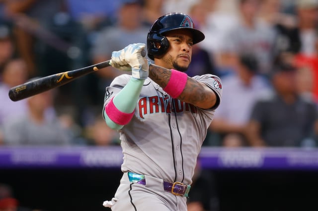 DENVER, CO - AUGUST 14: Ketel Marte #4 of the Arizona Diamondbacks hits a two RBI double in the fourth inning against the Colorado Rockies at Coors Field on August 14, 2025 in Denver, Colorado.
