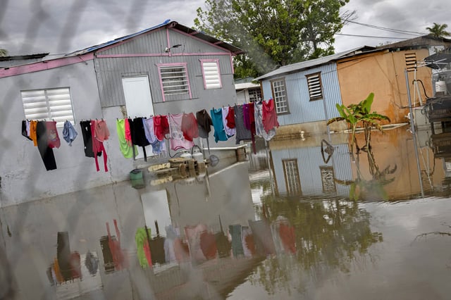 A house is seen partially flooded as  3 Hurricane Erin leaves the region in Guayama, Puerto Rico on August 17, 2025. 