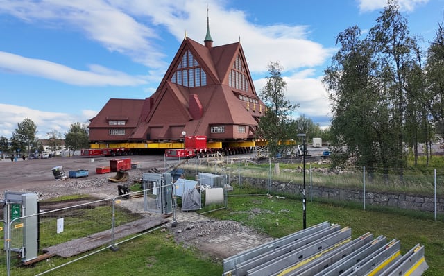 Kiruna's historic wooden church sits on wheels before being moved to its new site next to the cemetery, in Kiruna, Sweden August 17, 2025. REUTERS/Leonhard Foeger