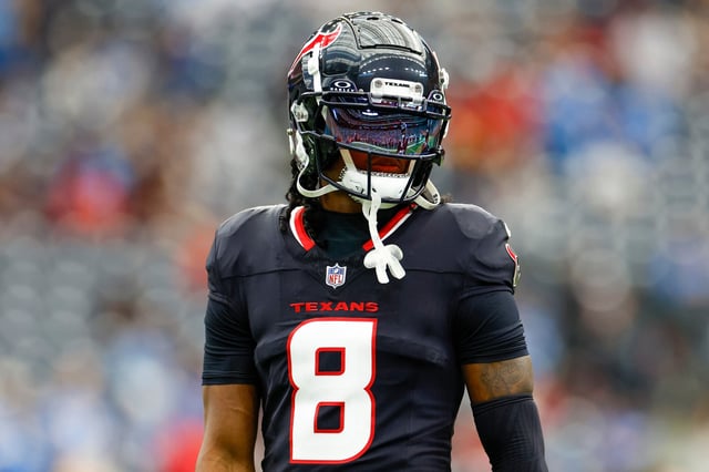 John Metchie III #8 of the Houston Texans warms up on the field prior to the AFC Wild Card Playoff game against the Los Angeles Chargers at NRG Stadium on January 11, 2025 in Houston, Texas.