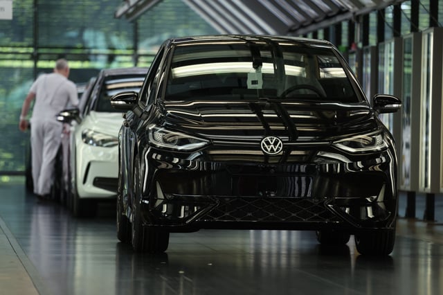 DRESDEN, GERMANY - MAY 14: A worker performs a visual check on new Volkswagen ID.3 electric cars at the Volkswagen plant on May 14, 2025 in Dresden, Germany. Volkswagen led sales of electric car sales in Germany that rose 54% overall in April compared to April of last year. (Photo by Sean Gallup/Getty Images)