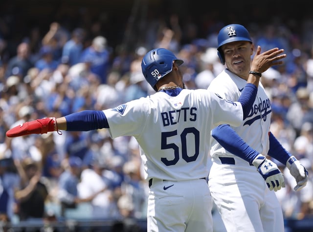 LOS ANGELES, CALIFORNIA - AUGUST 17: Freddie Freeman #5 of the Los Angeles Dodgers celebrates his three run home run with Mookie Betts #50, to take a 3-0 lead, during the first inning in the game between the San Diego Padres and the Los Angeles Dodgers at Dodger Stadium on August 17, 2025 in Los Angeles, California. (Photo by Harry How/Getty Images)