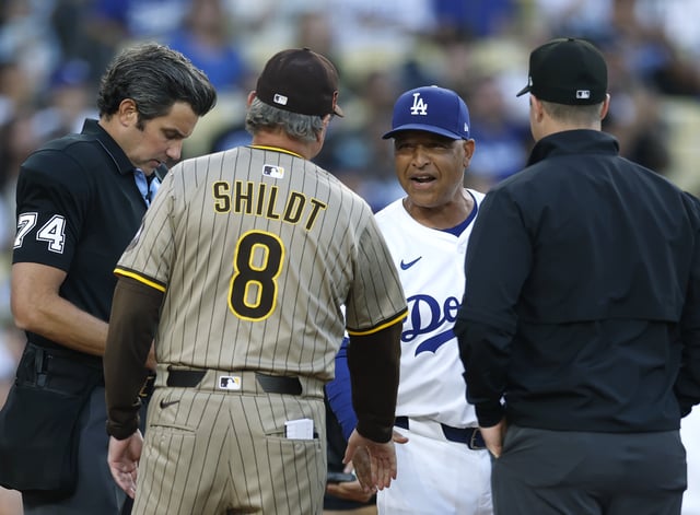 LOS ANGELES, CALIFORNIA - AUGUST 15: Dave Roberts #30 of the Los Angeles Dodgers and Mike Shildt #8 of the San Diego Padres meet with umpires before the game between the San Diego Padres and the Los Angeles Dodgers at Dodger Stadium on August 15, 2025 in Los Angeles, California. (Photo by Harry How/Getty Images)