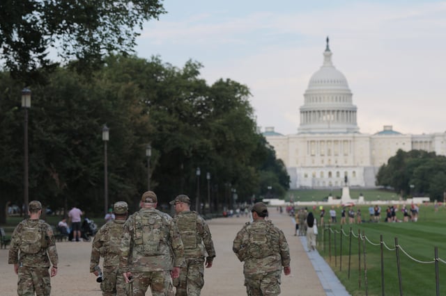 Members of the National Guard walk on the National Mall on August 14, 2025 in Washington, DC.