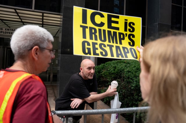 A person argues with people protesting Immigration and Customs Enforcement (ICE) efforts outside U.S. immigration court in Manhattan, in New York City, U.S., August 14, 2025. REUTERS/David 'Dee' Delgado/File Photo