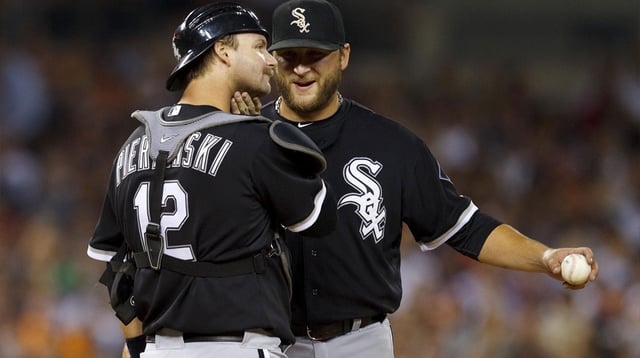 September 4, 2011; Detroit, MI, USA; Chicago White Sox catcher A.J. Pierzynski (12) talks to starting pitcher Mark Buehrle (right) during the game against the Detroit Tigers at Comerica Park. Mandatory Credit: Rick Osentoski-Imagn Images