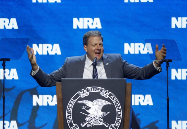 Governor of New Hampshire Chris Sununu speaks at the National Rifle Association (NRA) annual meeting held in Indianapolis, Indiana, U.S. April 14, 2023. REUTERS/Chris Bergin/File Photo