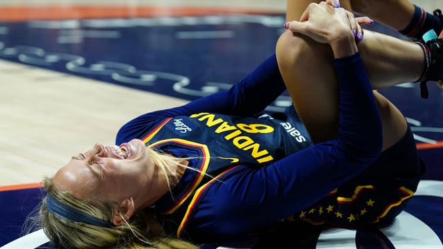 Aug 17, 2025; Uncasville, Connecticut, USA; Indiana Fever guard Sophie Cunningham (8) on the court injured as they take on the Connecticut Sun in the first half at Mohegan Sun Arena. Mandatory Credit: David Butler II-Imagn Images