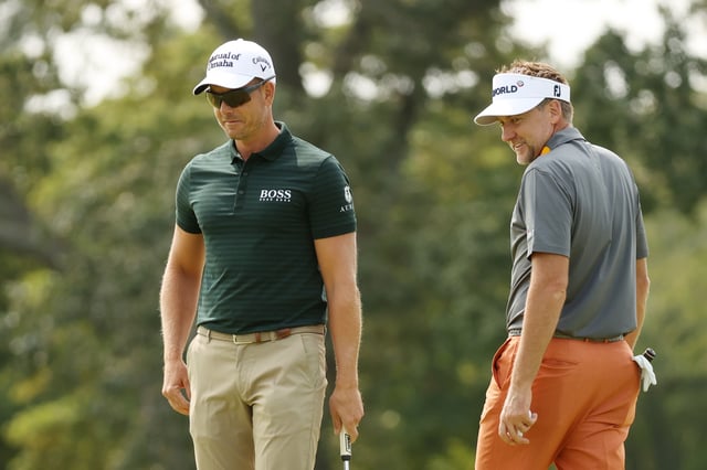 Henrik Stenson of Sweden and Ian Poulter of England smile on a green during a practice round prior to the 120th U.S. Open Championship on September 15, 2020 at Winged Foot Golf Club in Mamaroneck, New York.