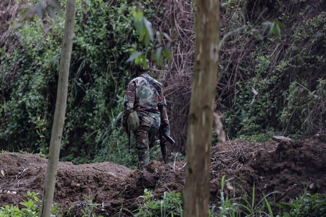 An M23 rebel walks on the outskirts of Matanda which is controlled by M23 rebels, in eastern Democratic Republic of Congo, March 22, 2025. REUTERS/Zohra Bensemra/File Photo