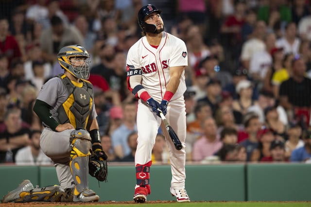 BOSTON, MA - JULY 9: Wilyer Abreu #52 of the Boston Red Sox hits a three-run home run during the second inning of a game against the Oakland Athletics on July 9, 2024 at Fenway Park in Boston, Massachusetts.