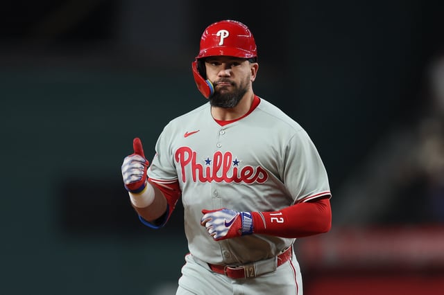 ARLINGTON, TEXAS - AUGUST 08: Kyle Schwarber #12 of the Philadelphia Phillies celebrates toward his dugout as he runs the bases on his first inning solo home run against the Texas Rangers at Globe Life Field on August 08, 2025 in Arlington, Texas. (Photo by Sam Hodde/Getty Images)