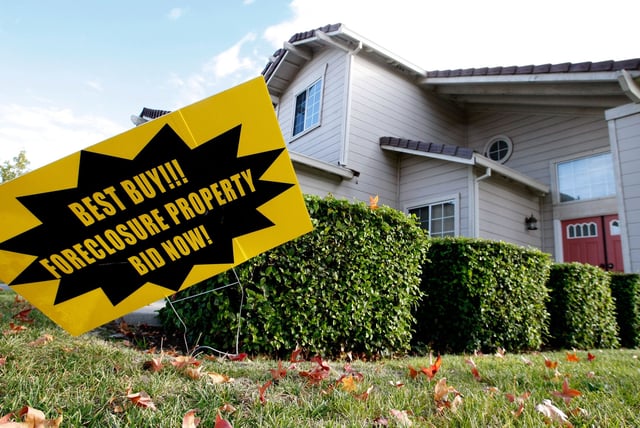 A foreclosure sale sign is seen in front of a foreclosed home in this archive stock photo taken in October 2007 in Antioch, California.