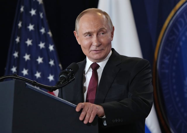 Russian President Vladimir Putin delivers a statement during a news conference with President Donald Trump at Joint Base Elmendorf-Richardson on August 15, 2025 in Anchorage, Alaska. 