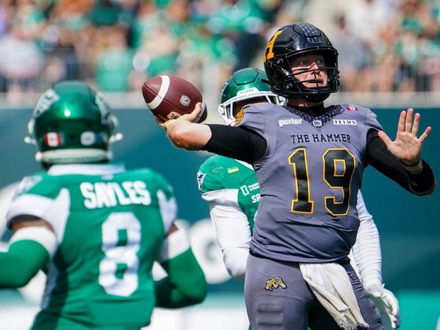 Hamilton Tiger-Cats quarterback Bo Levi Mitchell (19) throws against the Saskatchewan Roughriders during the second half of CFL football action in Regina, on Saturday, August 16, 2025.