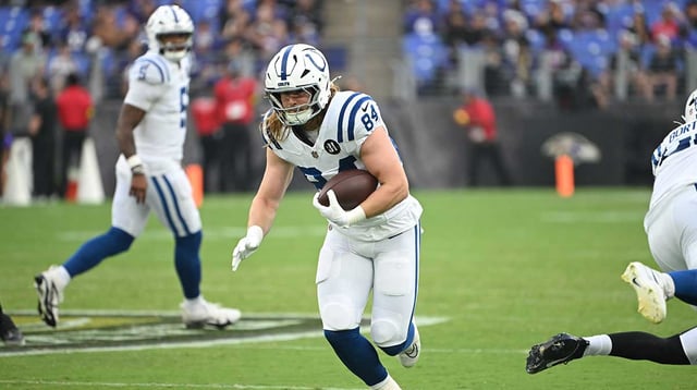 Aug 7, 2025; Baltimore, Maryland, USA; Indianapolis Colts tight end Tyler Warren (84) runs with the ball after making a catch against the Baltimore Ravens during the first quarter at M&amp;T Bank Stadium. Mandatory Credit: Rafael Suanes-Imagn Images