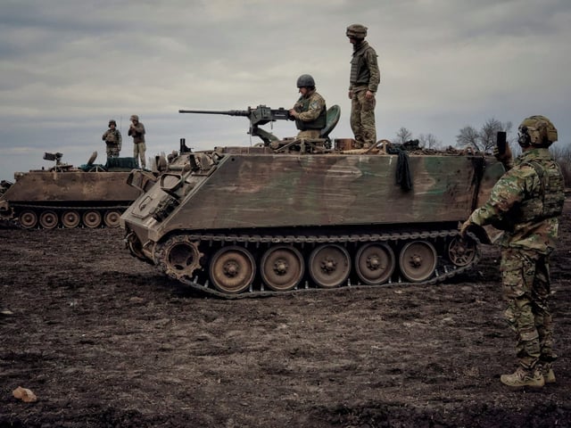 Russian state media footage showed a captured Ukrainian M113 armored personnel carrier hoisting US and Russian flags.