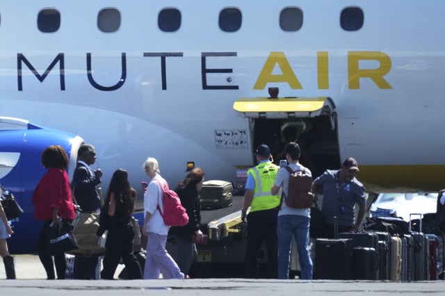 Texas Democratic lawmakers return to Texas after leaving two weeks ago to block a vote on a redrawn redistricting map, Monday, Aug. 18, 2025, in Austin, Texas. (AP Photo/Eric Gay)