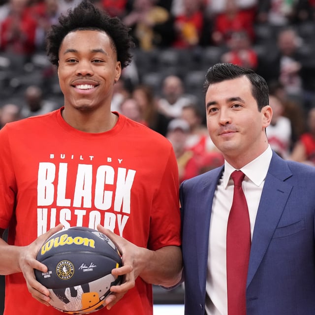Toronto Raptors' Scottie Barnes poses with General Manager Bobby Webster as he is presented with a ball to mark his All-Star selection before NBA basketball action against the Indiana Pacers in Toronto on Wednesday, February 14, 2024. THE CANADIAN PRESS/Chris Young