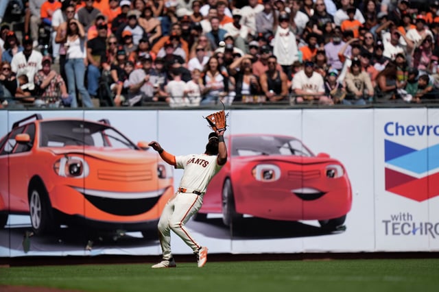 Heliot Ramos of the San Francisco Giants catches a fly ball at Oracle Park on Aug. 17, 2025 in San Francisco.