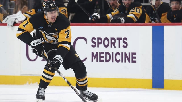 Apr 13, 2025; Pittsburgh, Pennsylvania, USA; Pittsburgh Penguins center Evgeni Malkin (71) skates with the puck against the Boston Bruins during the third period at PPG Paints Arena. Mandatory Credit: Charles LeClaire-Imagn Images