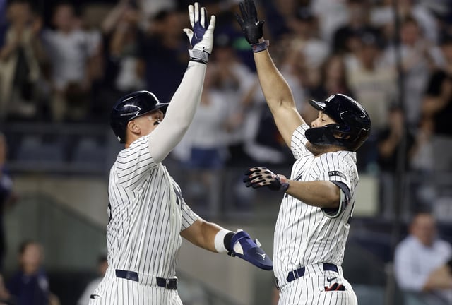 NEW YORK, NEW YORK - JULY 08: (NEW YORK DAILIES OUT) Giancarlo Stanton #27 of the New York Yankees celebrates his sixth inning three run home run against the Seattle Mariners with teammate Aaron Judge #99 at Yankee Stadium on July 08, 2025 in New York City. The Yankees defeated the Mariners 10-3.