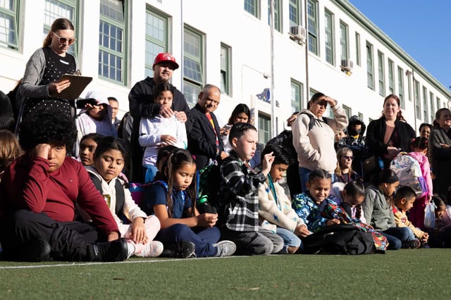 Students and parent gather during an assembly for the first day of school at Sanchez Elementary School in San Francisco on Monday.