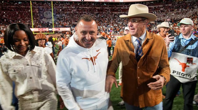 Dec 21, 2024; Austin, Texas, USA; Texas Longhorns head coach Steve Sarkisian and Chris Del Conte celebrate after defeating the Clemson Tigers in the NCAA College Football Playoffs first round game at Darrell K Royal Texas Memorial Stadium. Mandatory Credit: Ricardo B. Brazziell/USA Today Network via Imagn Images