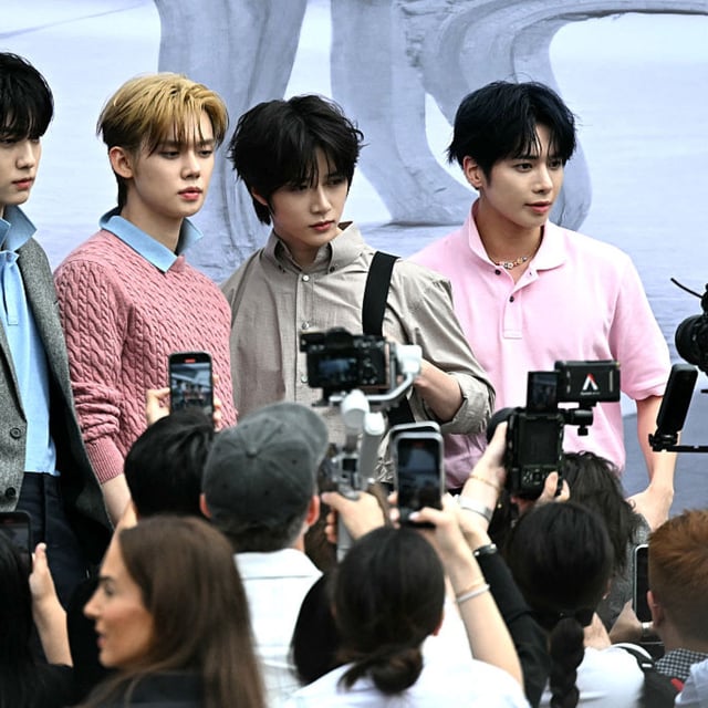 South Korean boy band Tomorrow X Together pose as they arrive at the Dior Homme's Menswear Ready-to-wear Spring-Summer 2026 collection fashion show as part of the Paris Fashion Week in Paris, on June 27, 2025.