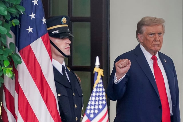 U.S. President Donald Trump gestures as he meets with Ukrainian President Volodymyr Zelenskiy (not pictured) at the White House amid negotiations to end the Russian war in Ukraine, in Washington, D.C., U.S., August 18, 2025. REUTERS/Nathan Howard