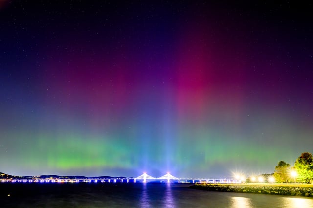 The Northern Lights or Aurora Borealis are visible over the Tappan Zee or Governor Mario M. Cuomo Bridge on October 11, 2024, near New York City.