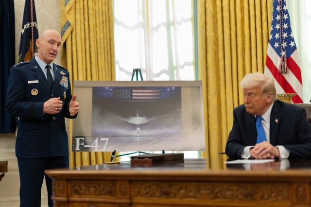 U.S. President Donald Trump listen to U.S. Chief of Staff of the Air Force David W. Allvin next to an image of an F-47 sixth-generation fighter jet in the Oval Office at the White House, in Washington, D.C., U.S., March 21, 2025. REUTERS/Carlos Barria/File photo
