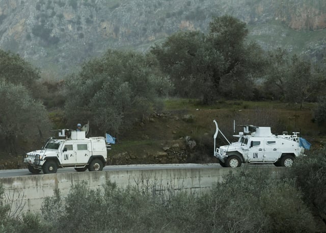 UN peacekeepers (UNIFIL) vehicles ride along a street in Marjaayoun, Southern Lebanon January 20, 2025. REUTERS/Mohamed Azakir/File Photo