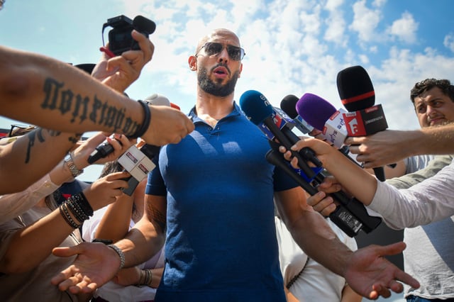  Andrew Tate speaks to reporters after being released from house arrest and put under judicial control measures, on the outskirts of Bucharest, Romania, Aug. 4, 2023.  