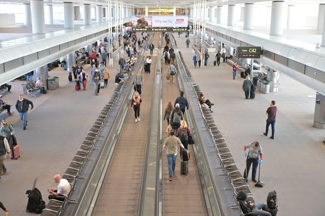 Travelers make their way through Concourse C at Denver International Airport on Feb. 28, 2024. (Photo by RJ Sangosti/The Denver Post)