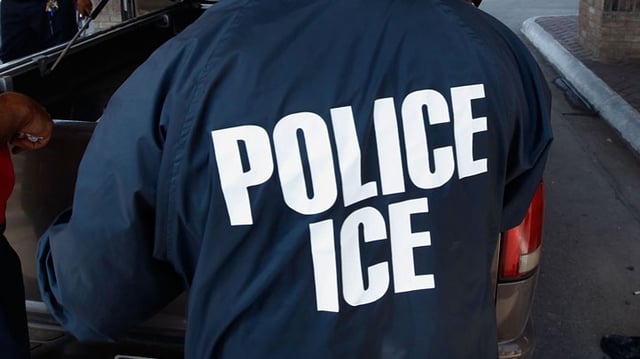 HIDALGO, TX – MAY 28:  Special agents from Immigration and Customs Enforcement (ICE), Border Patrol, and Customs and Border Protection (CBP) question a man while his vehicle is searched after he was stopped heading into Mexico at the Hidalgo border crossing on May 28, 2010 in Hidalgo, Texas. The inspection was part of a Department of Homeland Security (DHS) joint effort between ICE, CBP and Customs and Border Patrol. The organizations are trying to slow the flow of guns, money and drugs from the United State into Mexico.  (Photo by Scott Olson/Getty Images)