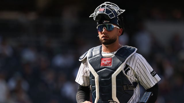 Jun 29, 2025; Bronx, New York, USA; New York Yankees catcher J.C. Escarra (25) walks off the field after the top of the eighth inning against the Athletics at Yankee Stadium. Mandatory Credit: Vincent Carchietta-Imagn Images