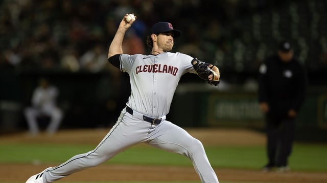Mar 28, 2024; Oakland, California, USA; Cleveland Guardians starting pitcher Shane Bieber (57) delivers a pitch against the Oakland Athletics during the third inning at Oakland-Alameda County Coliseum. Mandatory Credit: D. Ross Cameron-Imagn Images