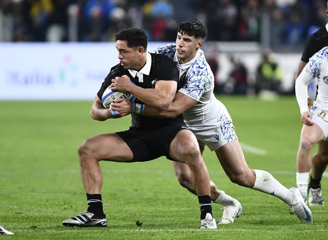 Rugby Union - Autumn Internationals - Italy v New Zealand - Allianz Stadium, Turin, Italy - November 23, 2024 New Zealand's Anton Lienert-Brown in action with Italy's Tommaso Menoncello REUTERS/Massimo Pinca/ File Photo