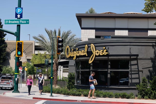 Pedestrians walk past the new Original Joe’s on Monday August, 11, 2025, in Walnut Creek, Calif. A kitchen fire Monday forced the restaurant to close down temporarily four days after its grand opening. 