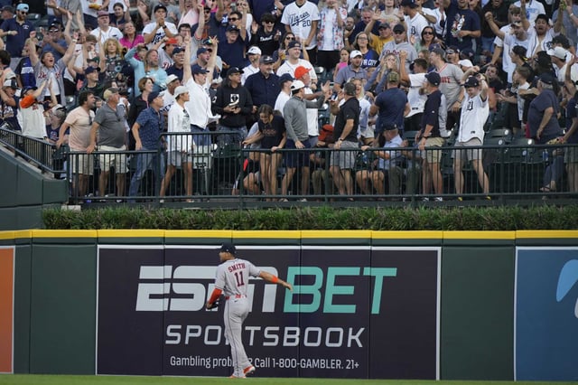 Houston Astros right fielder Cam Smith (11) reacts as fans cheer after a solo home run hit by Detroit Tigers&#39; Wenceel Perez during the fourth inning of a baseball game, Monday, Aug. 18, 2025, in Detroit. (AP Photo/Ryan Sun)