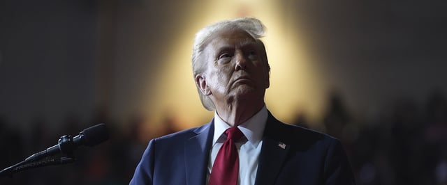 Donald Trump watches a video screen at a campaign rally at the Salem Civic Center, Saturday, Nov. 2, 2024, in Salem, Va. (AP Photo/Evan Vucci)