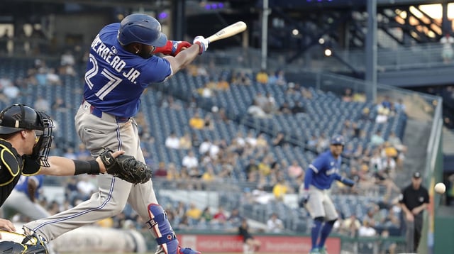 Aug 18, 2025; Pittsburgh, Pennsylvania, USA; Toronto Blue Jays first baseman Vladimir Guerrero Jr. (27) drives in a run with a fielders choice ground out against the Pittsburgh Pirates during the third inning at PNC Park. Mandatory Credit: Charles LeClaire-Imagn Images