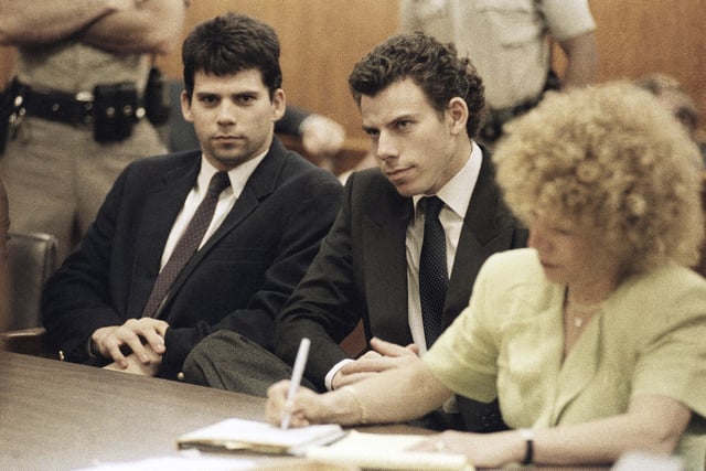 FILE - Lyle, left, and Erik Galen Menendez sit in a Beverly Hills, Calif., courtroom, May 14, 1990. (AP Photo/Kevork Djansezian, File)