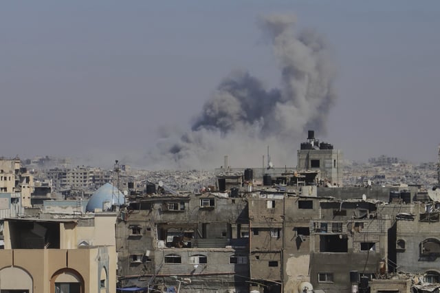 Smoke rises to the sky following an Israeli army airstrike in Khan Younis, in the Gaza Strip, Monday, Aug. 18, 2025. (AP Photo/Mariam Dagga)