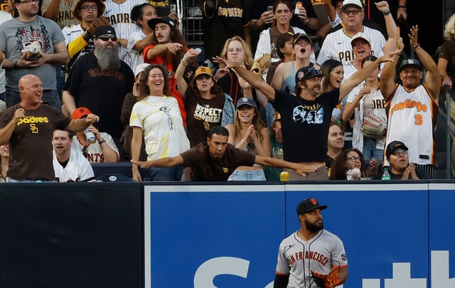 San Diego, CA – August 18, 2025: Heliot Ramos #17 of the San Francisco Giants looks on as fans celebrate a home run, that was eventually overturned because of fan interference hit by Xander Bogaerts #2 of the San Diego Padres at Petco Park on August 18, 2025 in San Diego, California. (K.C. Alfred / The San Diego Union-Tribune)