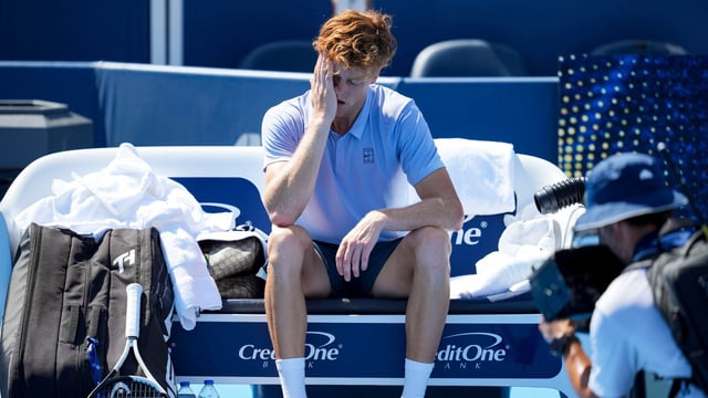Jannik Sinner (ITA) sits on his bench after retiring from his match against Carlos Alcaraz (ESP) during the Cincinnati Open at the Lindner Family Tennis Center