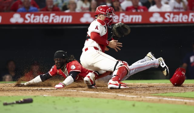The Cincinnati Reds’ Elly De La Cruz slides into home plate to score as Angels catcher Logan O’Hoppe waits for the throw during the fifth inning on Monday night at Angel Stadium. (AP Photo/Jessie Alcheh)